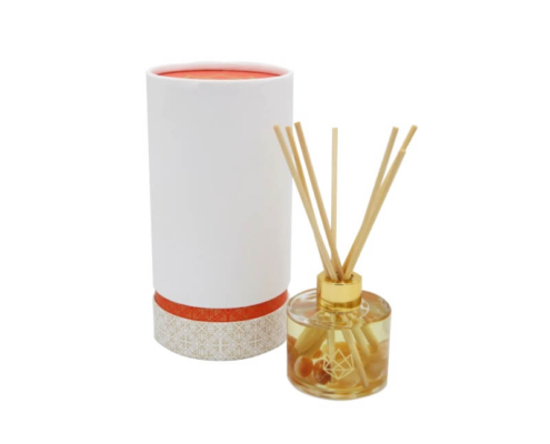 Elegant reed diffuser packaging wholesale solution featuring orange-accented custom paper tube.