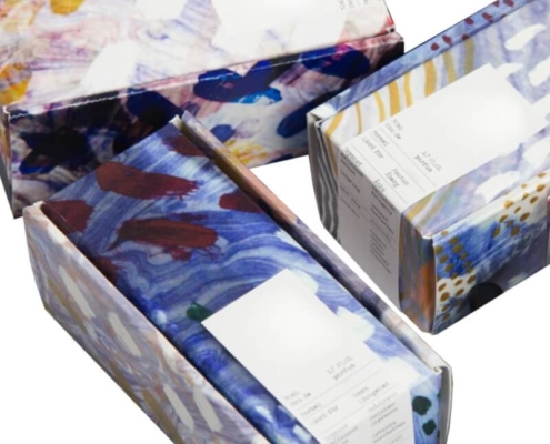 Stacked printed serum boxes in custom designs and colors – high-end serum boxes with flat shipping for skincare packaging.
