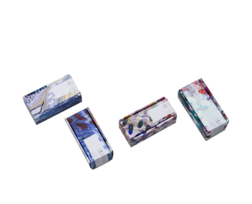 Four different printed serum boxes in artistic patterns – custom serum boxes for luxury cosmetic branding.