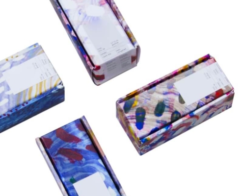 Top view of colorful printed serum boxes – modern serum boxes ideal for branding beauty and skincare products.