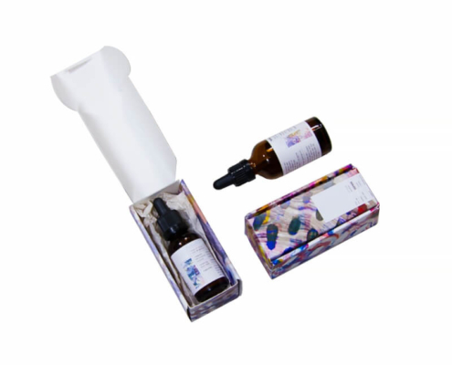Open printed serum boxes showing serum bottles inside – custom serum boxes with secure flip top carton packaging.