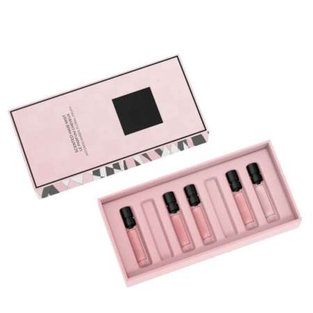 Premium perfume set in custom pink packaging with multiple fragrance bottles for gifting