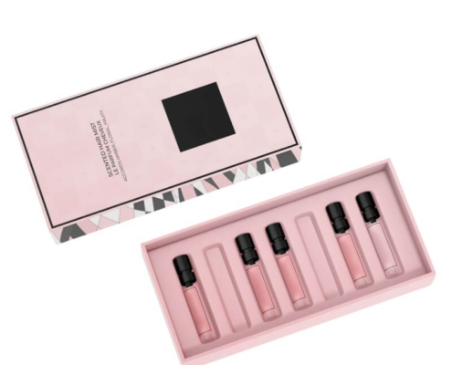 Premium perfume set in custom pink packaging with multiple fragrance bottles for gifting