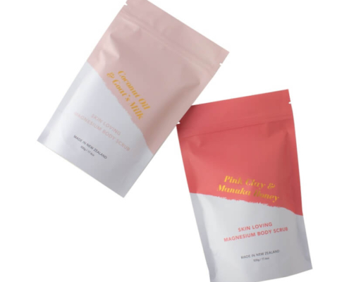Custom pastel pink and coral bath salt packaging bags with skin-loving natural ingredient labeling