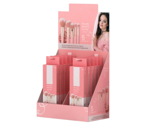 Pink counter display box with makeup brush sets arranged neatly in custom packaging for retail use